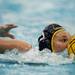 Michigan senior Kiki Golden pushes the ball forward while swimming in the game on Friday, April 26. Daniel Brenner I AnnArbor.com